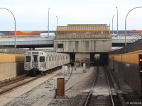 Arriving southbound at Lawrence West subway station, with a northbound train departing for Yorkdale.