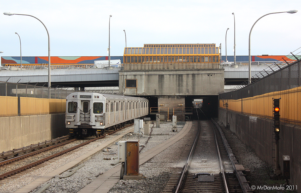 Arriving southbound at Lawrence West subway station, with a northbound train departing for Yorkdale.