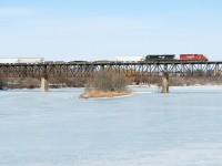A CP sd 40-2 and an NS Gevo make their way across the Grand River