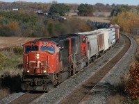 CN 305's conductor gives a wave as they roll by