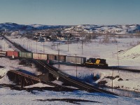 On a cold but clear late day atop the mound of slag at the CN-CP diamond with Coniston, Ontario in the background, RaiLink's Ottawa Valley 4203 is seen running a string of cars eastward to North Bay.