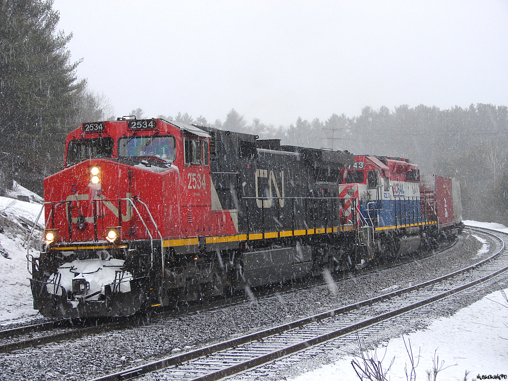 CN 2534/BCOL 743 about to knock down a clear signal at South Parry in the middle of an April blizzard. I forget what train # this is (can\'t find my OS book from \'08)