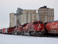 CP 223 passes the old Pool 8 elevator as it departs Thunder Bay with SD90MAC-H 9300 and SD90MAC 9107 leading Toronto to Winnipeg train 223 out of the Lakehead on a cloudy, but busy day.