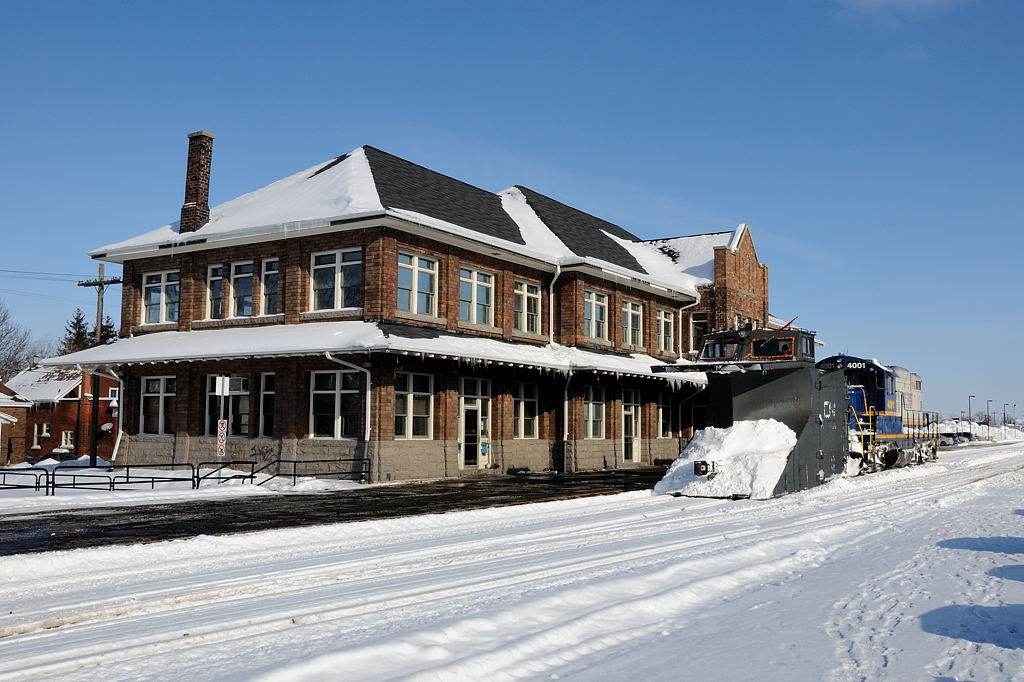After returning from plowing the Goderich Subdivision, Goderich and Exeter Plow Extra 518 pauses infront of the Stratford station to get their paperwork before plowing west towards London on the Guelph Sub.