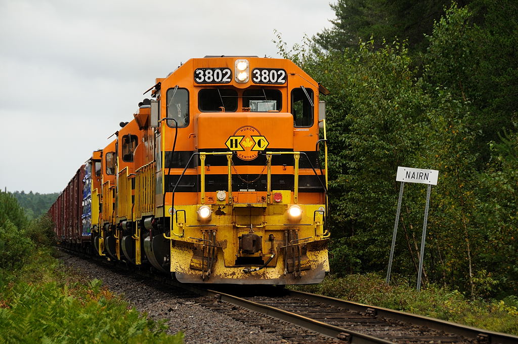 After a near imminent shutdown, Huron Central\'s freight 911 works 132 cars west up the grade out of Nairn along the HCRY Webbwood Subdivision.