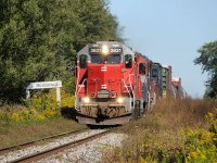 Goderich and Exeter Railway's Mac Yard to Stratford, Ontario freight 431, led by GEXR GP38 3821 - RLK GP35 2211 and leased HLCX SD40-2's 6522 and 6091 pass the overgrown siding at Mosborough, after working working Guelph.