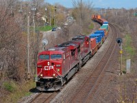 Westbound train 141 rolls though Beaconsfield on the double track Vaudreuil Sub. 