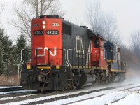 With leased CN 4700 leading long hood forward and nose-to-nose with RLK 1757, Southern Ontario Railway train 599 blasts through Copetown West at 60mph light power