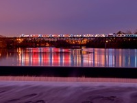 The biggest attention grabber out on the rails this season, Canadian Pacific\'s Holiday Train stops on top of the Grand River bridge allowing residents of near by Cambridge, Ontario to view the full spectacle of the train from the distance. 