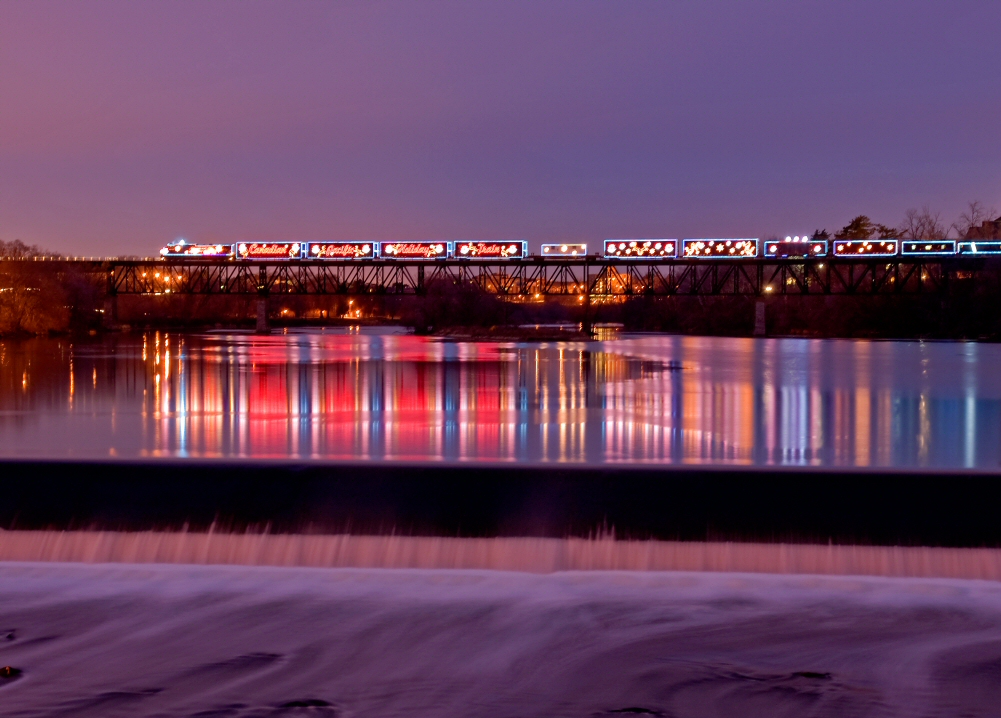 The biggest attention grabber out on the rails this season, Canadian Pacific\'s Holiday Train stops on top of the Grand River bridge allowing residents of near by Cambridge, Ontario to view the full spectacle of the train from the distance.