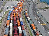 CP intermodal Lachine-Port de Montreal transfer job entering the port, surronded by a sea of containers to be loaded on ships.