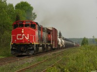 CN 450 - CN 9591 South starting the descent into Bracebridge with 38 cars, 37 of which are Sulphuric Acid loads which are heavier than one would think, making for a classic short and heavy train