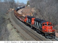 A CN Westbound departing Aldershot yard for Hamilton Yard with CN 4108 and 4018 and a decent size train. The GO TRIP third main track construction had recently begun and you can see grading in progress.