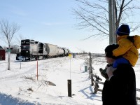 Rare encounters. The magical romance of a rickety branchline. In the middle of Simcoe County, a father and son stand at a rural crossing between Stayner and Collingwood as high nose GP9 CCGX 1001 lumbers its four car train along the Meaford Spur approaching the small rural hamlet of Batteaux. Due to dwindling traffic this portion of the Meaford Spur west Utopia to Collingwood will be abandoned by year end.