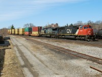 CN 382 makes its way downgrade through Brantford with an ex lms Ge in tow
