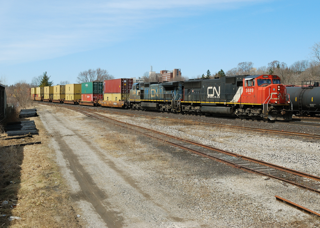 CN 382 makes its way downgrade through Brantford with an ex lms Ge in tow