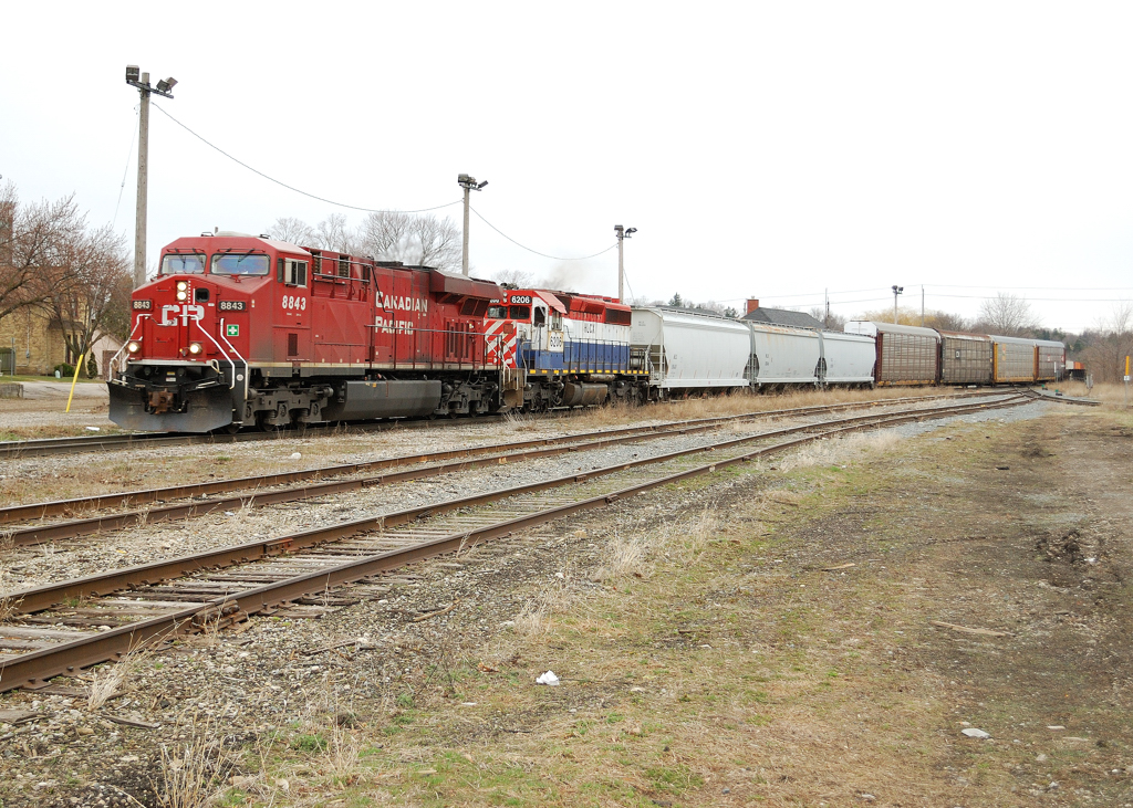A CP Gevo and an ex BC Rail sd 40-2 haul an eastbound freight through Galt