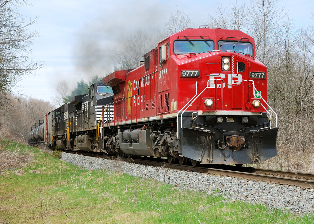 CP 626 makes it way down the Hamilton Sub after waiting for a couple CP Northbounds to come off the Hamilton Sub. Power for this 626 is CP 9777(from the Unstopable moive)+ NS 9681(GE)+ NS 6780(sd 60)