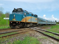 VIA 6436 pulls 4 Budd coaches across the diamond at Carew