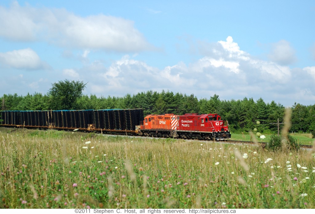 GP9 # 8200 is leading CP Train #142  heading east on the Galt Subdivision with automotive frames from the Formet (Magna) plant in St. Thomas to the Oshawa truck plant.