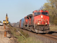 CN 2636 west leads train M377 through Shannonville passing the equipment working on the triple track project