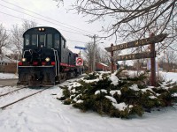 The crew of the Ontario Southland Railway brings their train south through snow covered Guelph after working the industrial park at the north end of town.