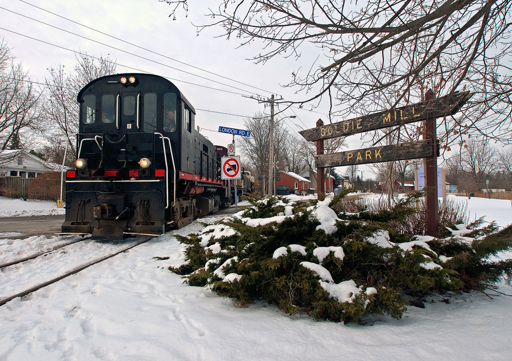 The crew of the Ontario Southland Railway brings their train south through snow covered Guelph after working the industrial park at the north end of town.
