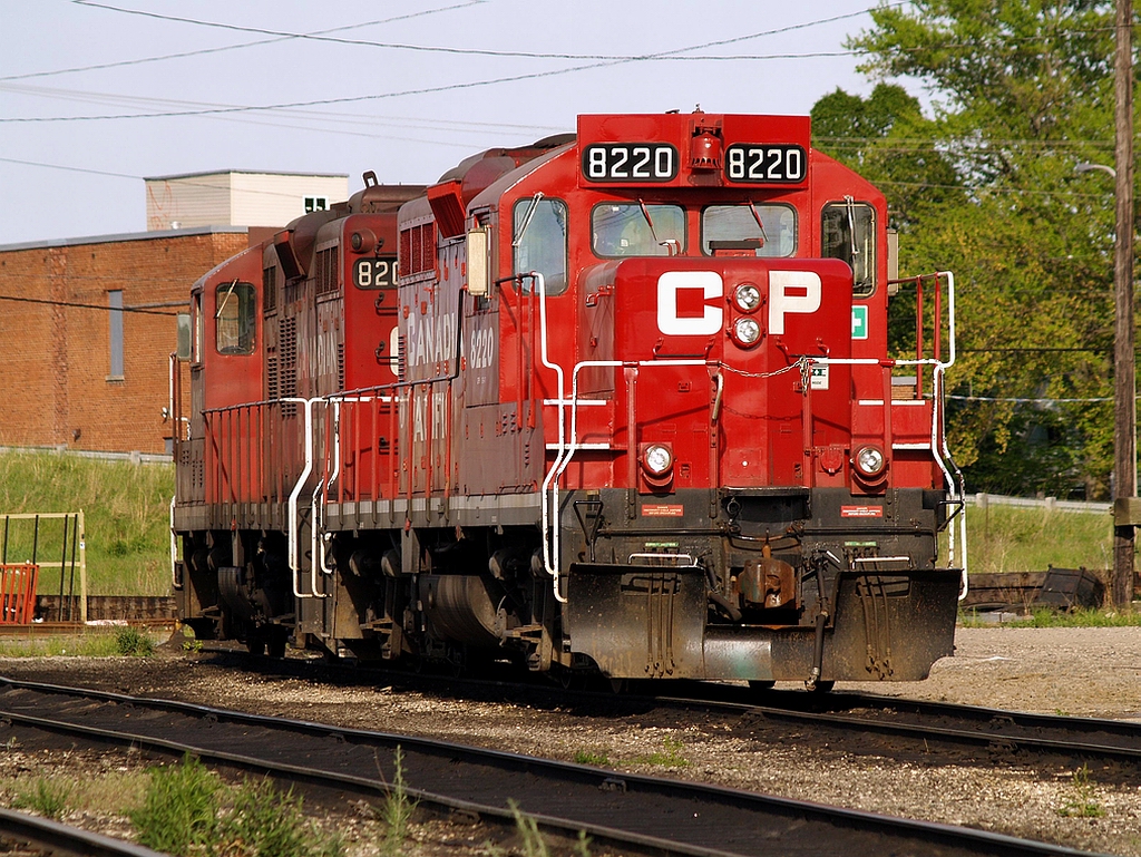 A pair of GP-9\'s sit in what used to be the engine service area where units could be re-fueled or turned on the turntable. The location of the former turntable pit can just be seen behind CP 8220 - CP 8207.
