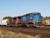 IC 2460 - CN 2272 leads 98 cars eastbound by the west end of Brantford Yard @ 10:39.