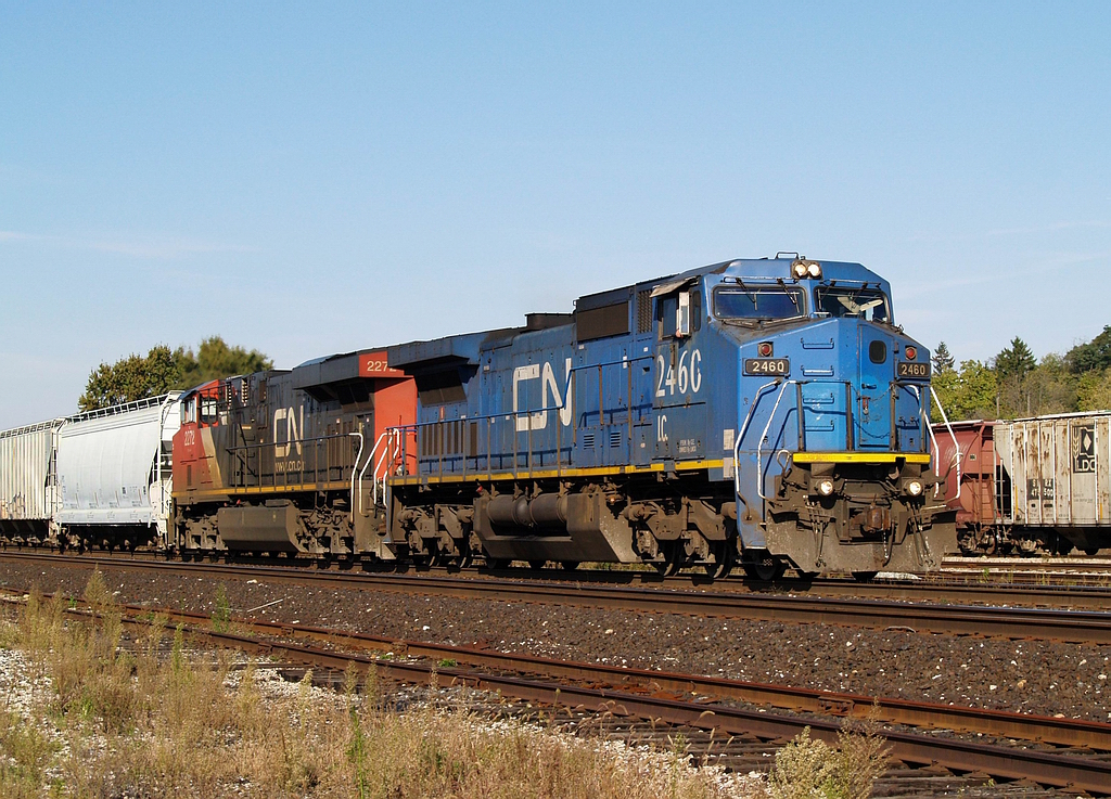 IC 2460 - CN 2272 leads 98 cars eastbound by the west end of Brantford Yard @ 10:39.
