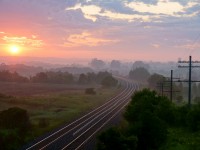 The first light of day arrives to lighten the valley, the tracks and the mind of this railroader/photographer to the world that he see\'s in his own eyes, waiting for the first daylight train to fill the frame of his camera. 