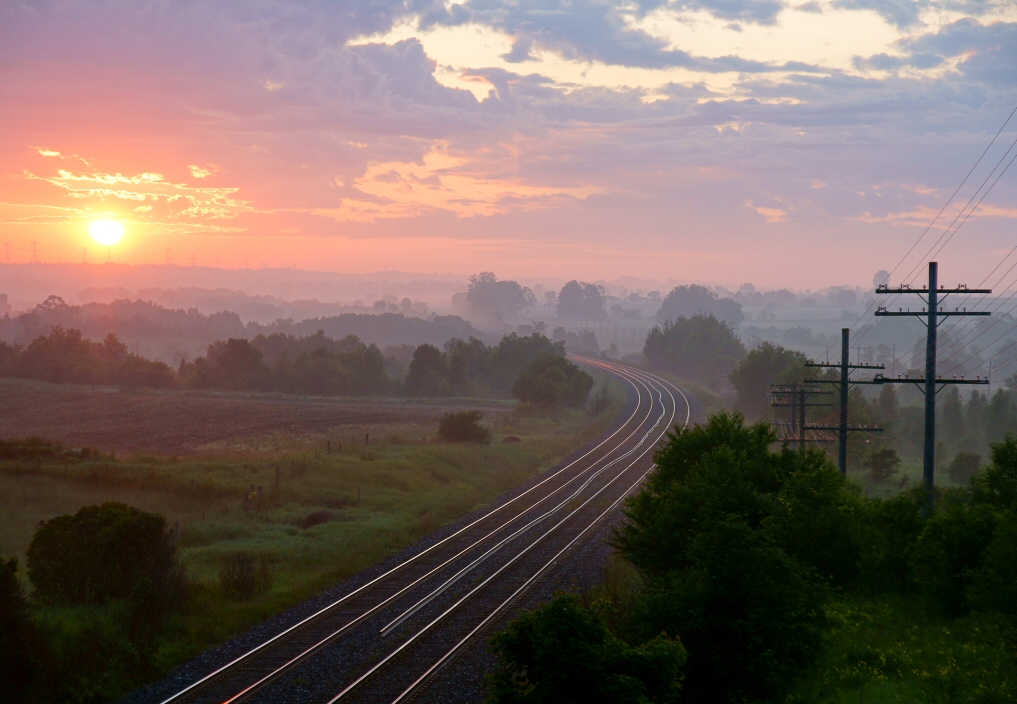 The first light of day arrives to lighten the valley, the tracks and the mind of this railroader/photographer to the world that he see\'s in his own eyes, waiting for the first daylight train to fill the frame of his camera.