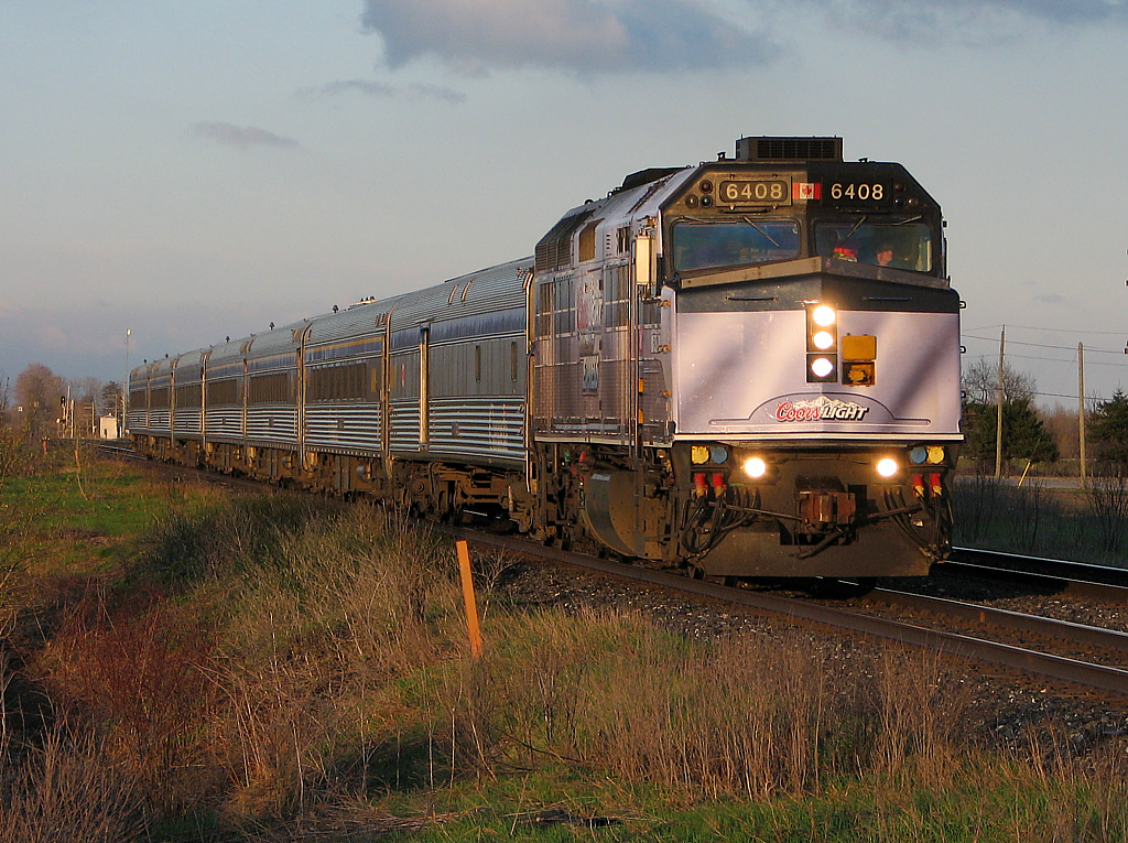 VIA 6408 leads train 75 towards a station stop in London.