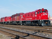 Finally able to lead after many months of trailing, CP 2100's paint job glows brightly in morning light as the Transfer crew takes 5 before heading out with a cut of cars for Agincourt Yard.