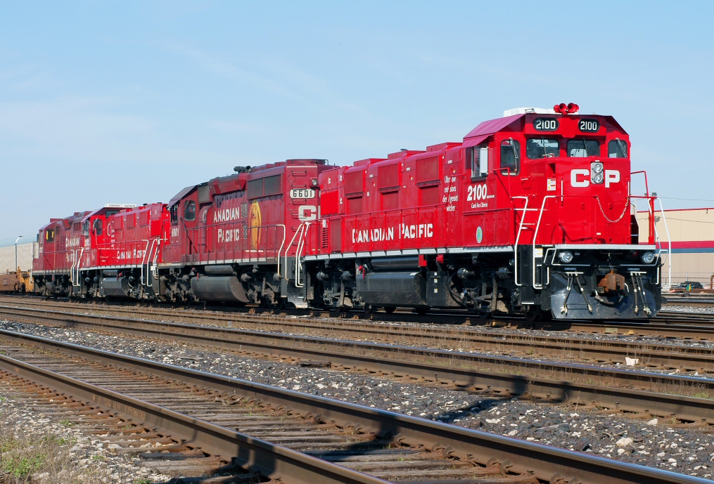 Finally able to lead after many months of trailing, CP 2100\'s paint job glows brightly in morning light as the Transfer crew takes 5 before heading out with a cut of cars for Agincourt Yard.