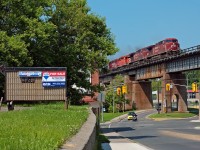 The quiet town of Port Hope plays to two main railways in Canada, Canadian National and Canadian Pacific, here we see one of the two roads in action as a pair of AC4400\'s leading an SD40-2 and a GP38-2 throttling up eastbound with a lengthy freight to Montreal.