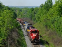 A northbound Canadian Pacific freight works up the grade at Mile 62 on the Hamilton Subdivision. CP 5690 - ICE 6411 - CITX 3082 - ICE 6439