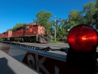 A pair of action red SD40-2's lead a short westbound. 