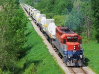 RLK 2211 accelerates through St. Marys with 9 semi built Ferromex sd 70 aces. These new units had been stored in Stratford due to an impeding strike at GM London.