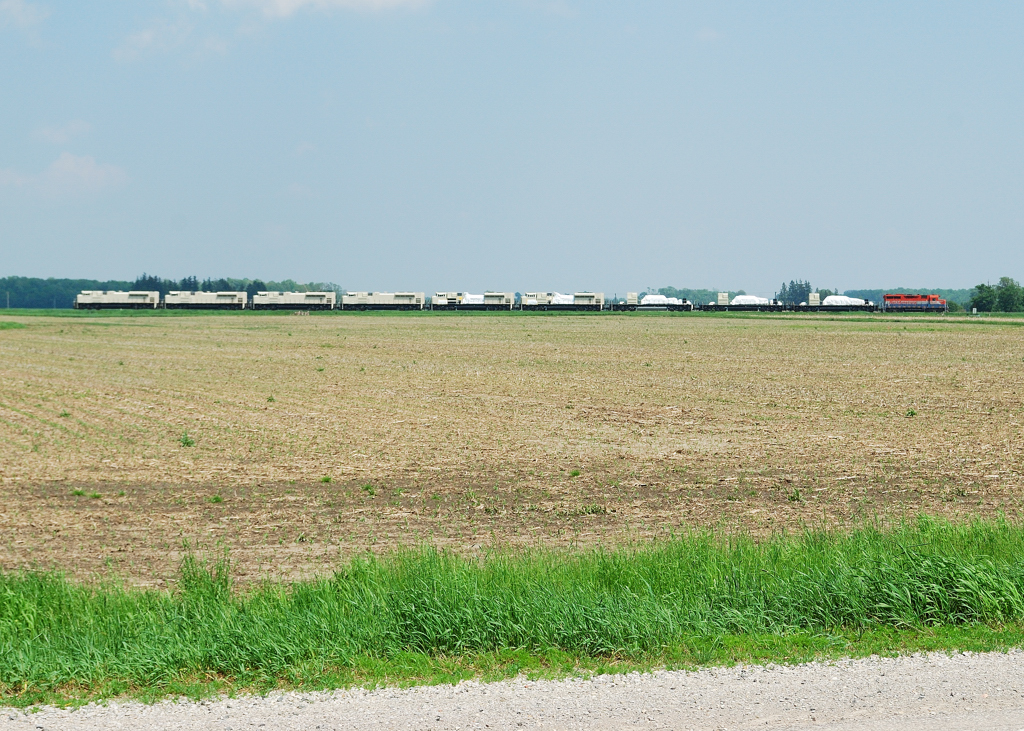 RLK 2211 accelerates across the county side with 9 semi built Ferromex sd 70 aces. These new units had been stored in Stratford due to an impeding strike at GM London.