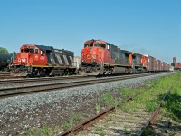 CN 435- CN 2508+CN(EX BNSF) 2138 passes CN 4701 sitting at the west end of Brantford Yard. 