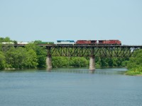 CP 240 makes its way over the Grand River with SLRG B39-8E 8524 in tow. The SLRG 8524 is headed to the Saratoga and North Creek Railroad in Saratoga Springs, NY.