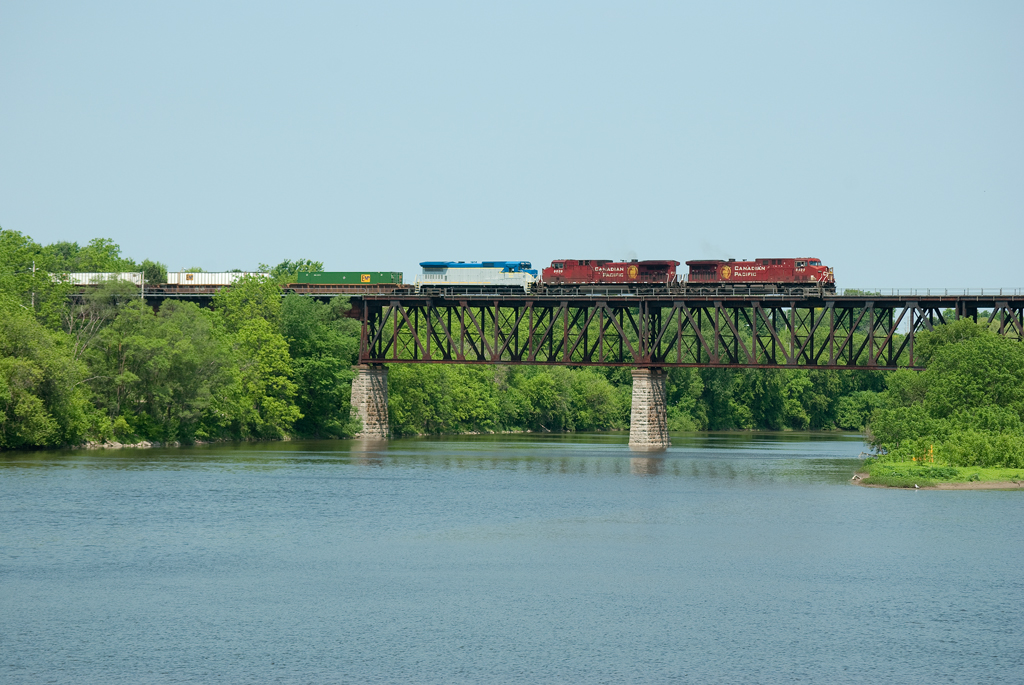 CP 240 makes its way over the Grand River with SLRG B39-8E 8524 in tow. The SLRG 8524 is headed to the Saratoga and North Creek Railroad in Saratoga Springs, NY.
