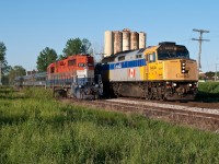 A rare meet in the small Baden Siding. VIA 6404 flies its 4 budd cars past RLK 2211 which has run out of time on the Baden Turn. Also of note the yellow bins in the background are currently in the process of being torn down as the rail serviced trackisde buisness has moved to New Hamburg.