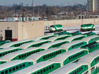 Out numbered by her successful rivals, GO 555 and her sister 556 sit across from each other, the row of MP40 in the foreground are now the normal commuter power for the trains before afternoon rush commences later in the day. 
