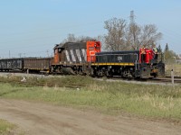 CN GP38-2 7526 and HBU-4 514 slug unit transfer cars from the local industrial area to CN's Clover bar yard on the east side of Edmonton