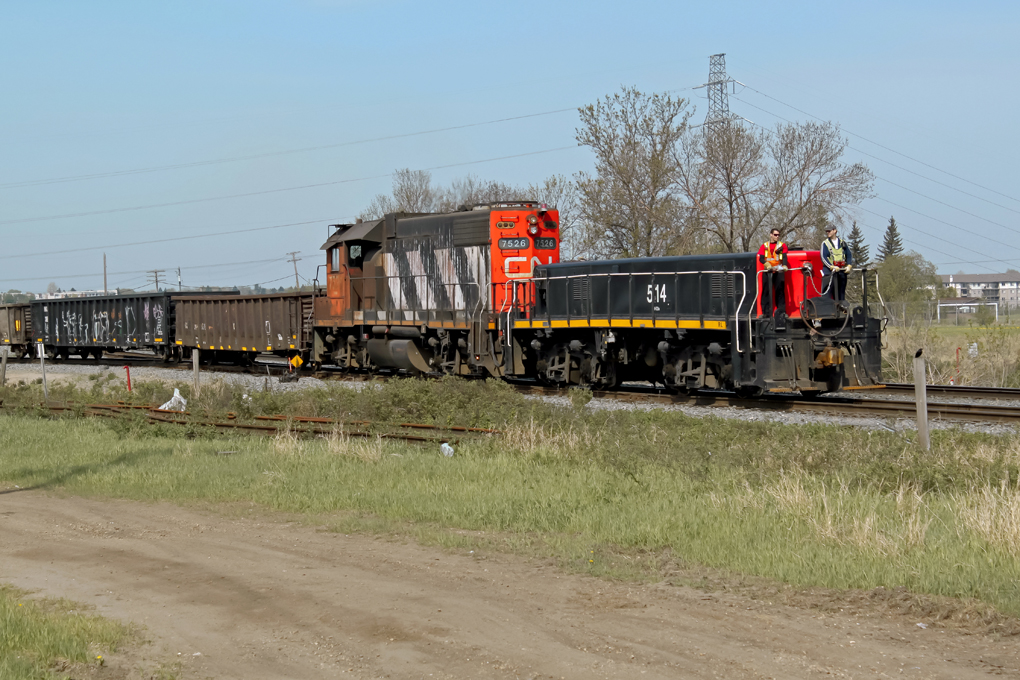 CN GP38-2 7526 and HBU-4 514 slug unit transfer cars from the local industrial area to CN\'s Clover bar yard on the east side of Edmonton