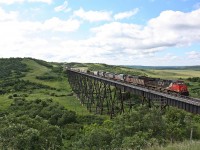 CN 403 with ex-GCFX/WC SD40-3's owned by JCLX are bound for Last Mountain Railway at Bethune Saskatchewan cross the Uno trestle.