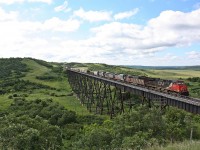 CN 403 with ex-GCFX/WC SD40-3's owned by JCLX are bound for Last Mountain Railway at Bethune Saskatchewan cross the Uno trestle.