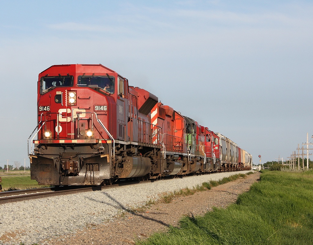 CP 451 with CP 9149 6076 CITX 3026 CP 3110 and 3044 and 12 cars just east of Fleming Sk.